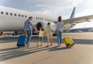 MITR Services – A Premier Choice for All Your Travel Needs 2 dad mom children together airport near plane