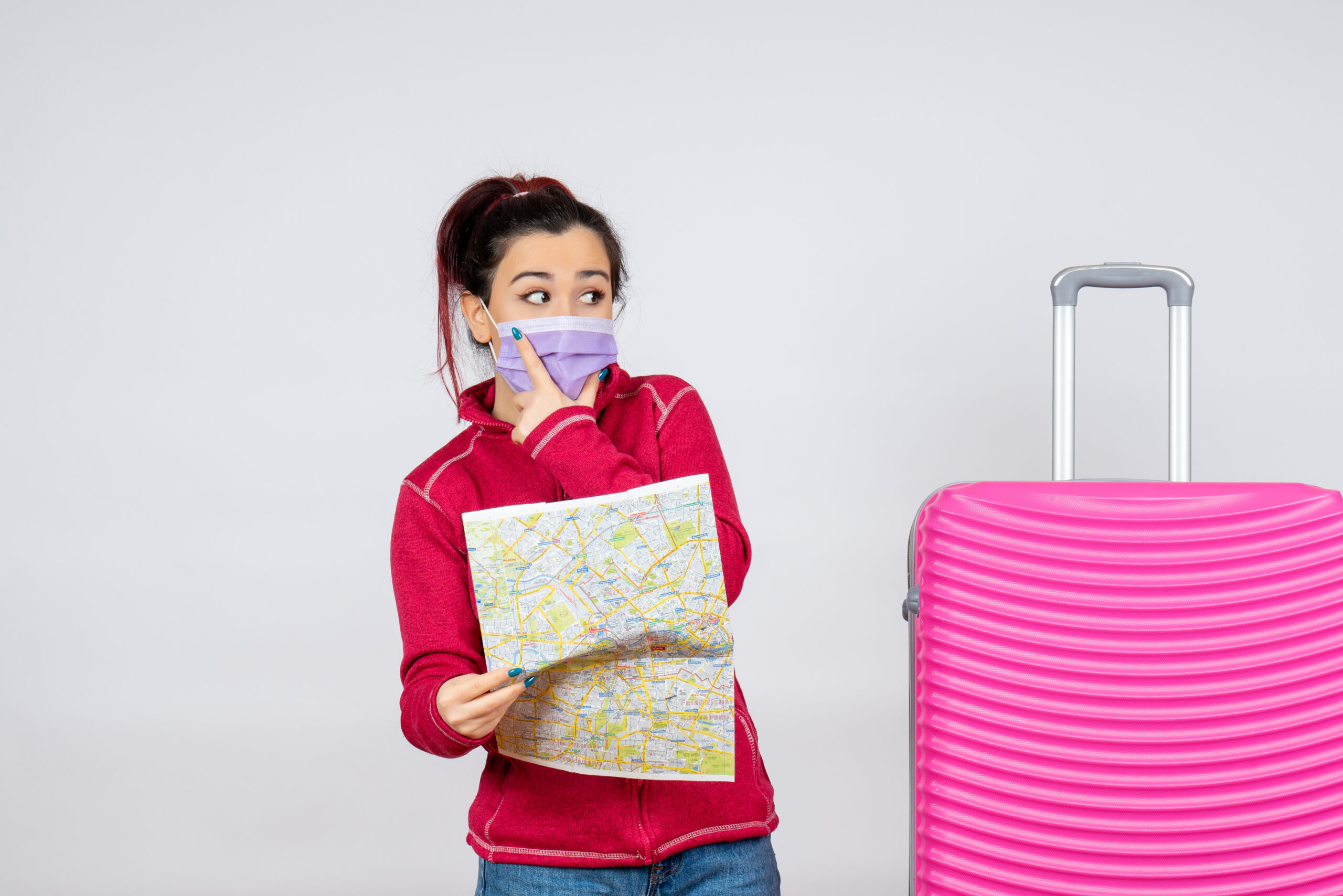 front view female tourist holding map mask white wall scaled
